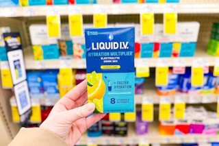 person holding a box of liquid iv hydration multiplier
