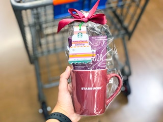 hand holding starbucks gift mug at Walmart