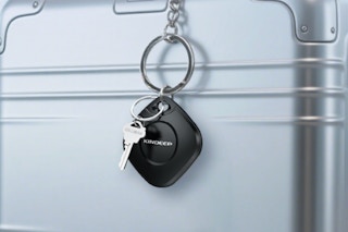 KINDEEP Air Tracker Tag 4 Pack on an aluminum carry-on.