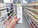 hand holding dove shampoo in walgreens