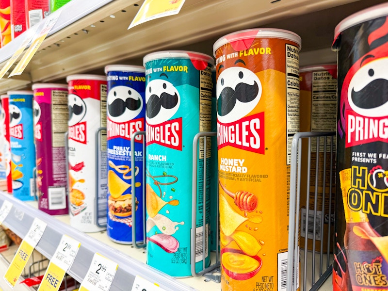 cans of pringles on a shelf