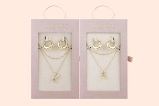 Unwritten 14k gold flash-plated necklace and earring set at Macy's on a peach background