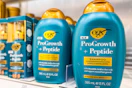 ogx shampoo and conditioner sitting on a target shelf