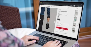 Someone shopping for the new Lululemon dual pouch wristlet on a laptop