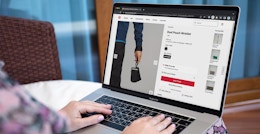 Someone shopping for the new Lululemon dual pouch wristlet on a laptop