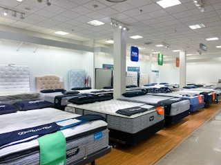 Mattresses on display in a store.