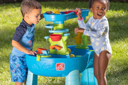 kids' playing with Step2 splash table