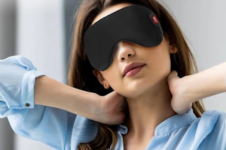 woman wearing black heated eye mask