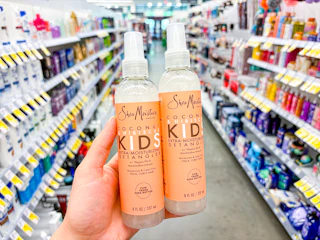 hand holding hair detangler in walgreens