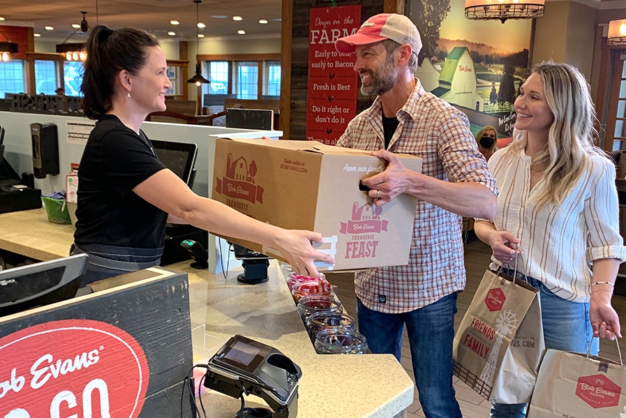 couple picking up a thanksgiving family meal at bob evans restaurant