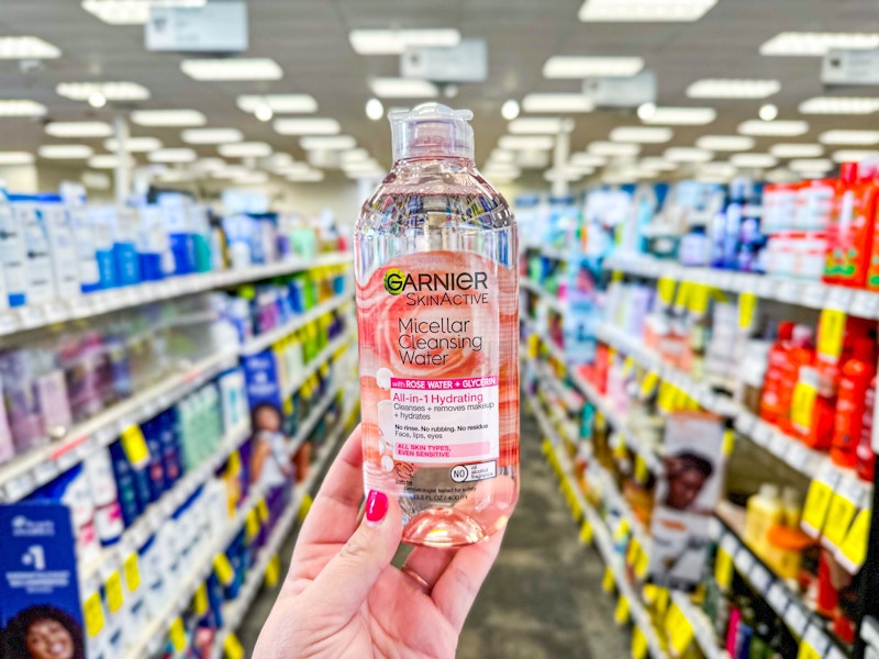 person holding a garnier micellar water in an aisle