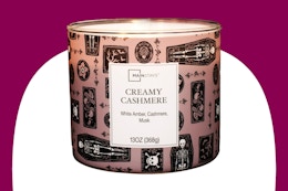 Stock image of the Mainstays Creamy Cashmere Scented 3-Wick Candle.