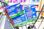 three boxes of claritin allergy relief in a shopping cart