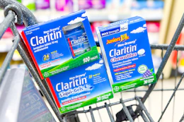 three boxes of claritin allergy relief in a shopping cart