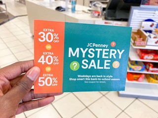 hand holding jcpenney coupon