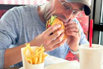 a man eating a burger