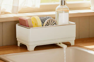 sponge holder next to kitchen sink