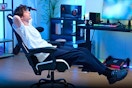 Lifestyle image of young man reclining in he Gtracing Gaming Chair in room setting