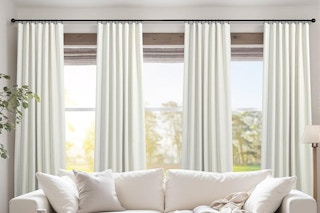 long curtains hanging behind couch