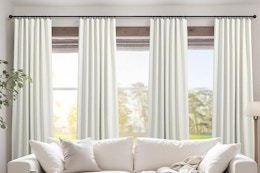 long curtains hanging behind couch