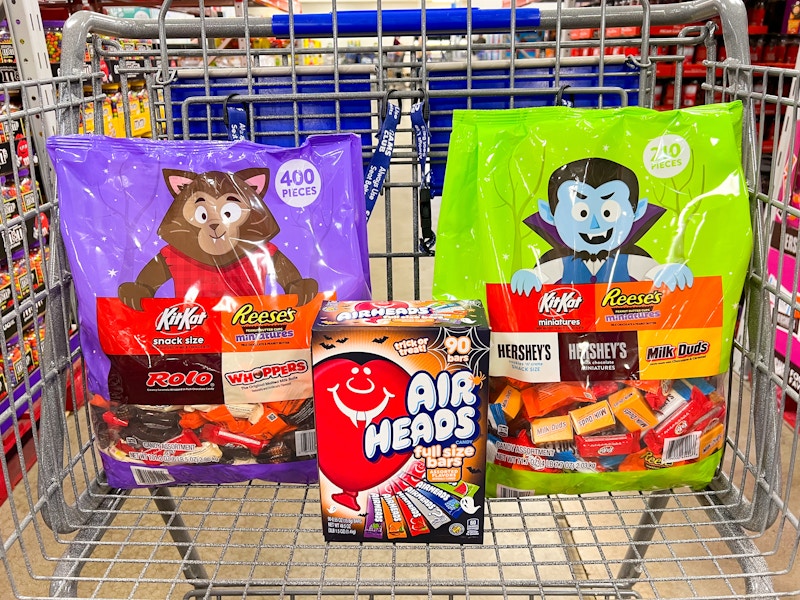bulk bags of halloween candy in a cart
