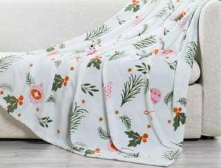 a holiday throw that comes with a matching santa sack