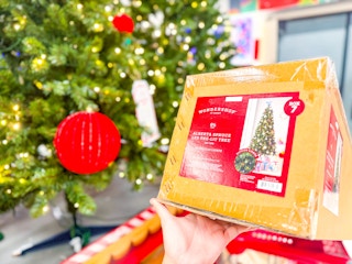 wondershop christmas tree sitting on a target cart