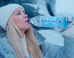 a person drinking a bottle of water