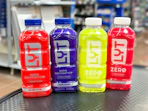 4 lyt drinks sitting on a table at walmart