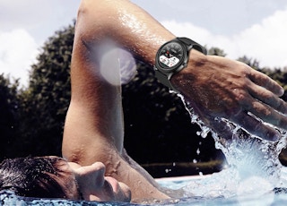 someone swimming wearing a watch