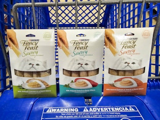 3 fancy feast puree cat treats in a cart