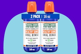 TheraBreath Healthy Gums Mouthwash Clean Mint on a blue background.