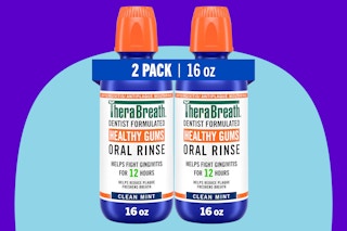 TheraBreath Healthy Gums Mouthwash Clean Mint on a blue background.