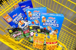 kellogg's cereal, trolli candy, purina and pedigree dog food in a yellow shopping cart