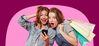 two ladies on their phone with shopping bags