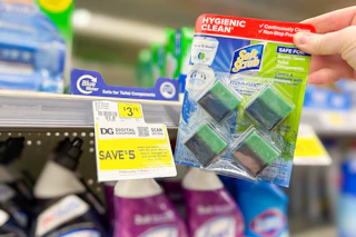 hand holding soft scrub toilet cleaner next to sale tag