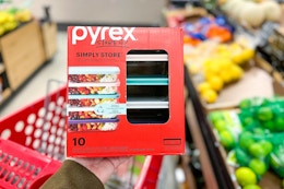hand holding a pyrex glass meal prep set in front of a target shelf
