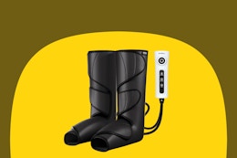 A pair of black foot and leg massagers with a corded controller