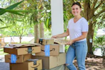 woman with stack of amazon boxes