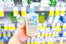 hand holding cerave renewing cleanser in walgreens