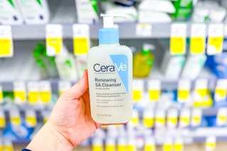 hand holding cerave renewing cleanser in walgreens