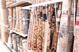area rugs on a shelf at target