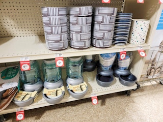 pet bowls and automatic feeders on a shelf