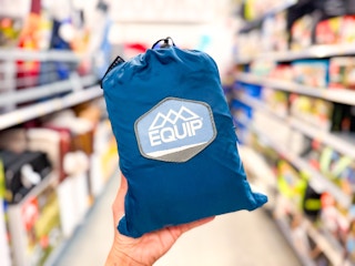 hand holding equip hammock in walmart aisle