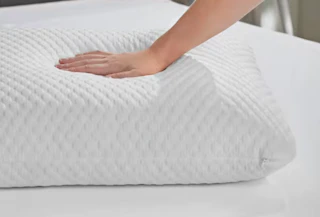 a hand on a pillow