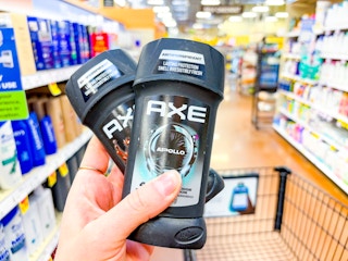hand holding axe deodorant at kroger