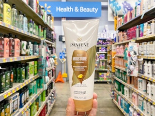 hand holding pantene pro v moisture renewal conditioner at walmart