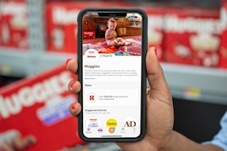 Fetch Rewards on a cell phone display a huggies diaper deal