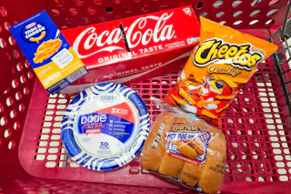 kraft mac & cheese, dixie paper plates, coca-cola, cheetos, and ball park hot dog buns in a cart
