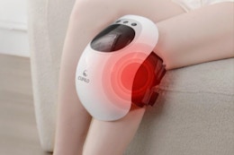 Woman wearing the CuPiLo Knee Massager with Heat on her knee.